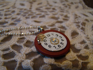 Small vintage watch face pendant on vintage poker chip with steampunk embellishments